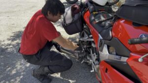 Bryan removing a hot exhaust from his VFR800